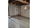 Unfinished basement with exposed framing and brick walls at 3510 W Seldon Ln, Phoenix, AZ 85051