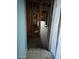 Hallway under renovation, showing exposed framing and flooring at 3510 W Seldon Ln, Phoenix, AZ 85051