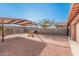 Large backyard with covered patio, swing set, and brick paver pathway at 3621 W Glass Ln, Phoenix, AZ 85041