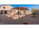 Spacious backyard with covered patio, swing set, and shed at 3621 W Glass Ln, Phoenix, AZ 85041