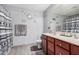 Modern bathroom with double sinks, large mirror, and patterned shower curtain at 3621 W Glass Ln, Phoenix, AZ 85041