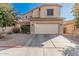 Two-story house with tan exterior, attached garage, and driveway at 3621 W Glass Ln, Phoenix, AZ 85041