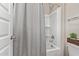 Clean bathroom with gray shower curtain and white bathtub at 36582 N Lincoln Red Rd, San Tan Valley, AZ 85143