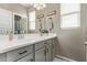 Modern bathroom with gray cabinets and double vanity at 36582 N Lincoln Red Rd, San Tan Valley, AZ 85143