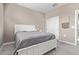 Bright bedroom with a white bed frame and gray bedding at 36582 N Lincoln Red Rd, San Tan Valley, AZ 85143