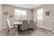 Dining room with a rustic wooden table and six beige chairs at 36582 N Lincoln Red Rd, San Tan Valley, AZ 85143