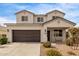 Two-story house with a brown garage door and landscaped front yard at 36582 N Lincoln Red Rd, San Tan Valley, AZ 85143