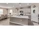 Modern kitchen with island, stainless steel appliances, and ample cabinet space at 36582 N Lincoln Red Rd, San Tan Valley, AZ 85143