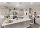 Modern kitchen with gray cabinets and a large island at 36582 N Lincoln Red Rd, San Tan Valley, AZ 85143