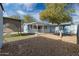 View of backyard with covered patio and gravel landscaping at 3707 W Encanto Blvd, Phoenix, AZ 85009