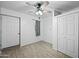 Bedroom with ceiling fan, tile floors, and closet at 3707 W Encanto Blvd, Phoenix, AZ 85009