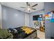 Bedroom with a double bed, shelving, and ceiling fan at 3707 W Encanto Blvd, Phoenix, AZ 85009