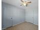 Spacious bedroom with tiled floors and double closets at 3707 W Encanto Blvd, Phoenix, AZ 85009