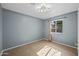 Simple bedroom with tiled floors and a window with curtains at 3707 W Encanto Blvd, Phoenix, AZ 85009