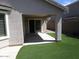 Covered patio with sliding glass doors leading to the backyard at 3919 E Blue Sage Rd, Gilbert, AZ 85297