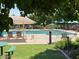 Community pool with lounge chairs and shaded seating areas at 3919 E Blue Sage Rd, Gilbert, AZ 85297