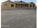 An unfinished single-story home shows its exterior with windows and a porch roof that has posts at 3972 E Hash Knife Draw Rd, San Tan Valley, AZ 85140