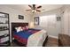 Baseball-themed bedroom with wood flooring and ceiling fan at 4741 S Desert Dawn Dr, Gold Canyon, AZ 85118