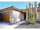 View of the front entrance and a large cactus in the front yard at 4741 S Desert Dawn Dr, Gold Canyon, AZ 85118