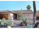 Desert landscaping surrounds this single-story home with a two-car garage at 4741 S Desert Dawn Dr, Gold Canyon, AZ 85118