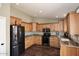 Kitchen with light wood cabinets, granite counters, and stainless steel appliances at 4741 S Desert Dawn Dr, Gold Canyon, AZ 85118