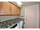 Laundry room with wood cabinets and washer/dryer hookups at 4741 S Desert Dawn Dr, Gold Canyon, AZ 85118