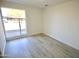 Bright bedroom featuring a large window and light wood flooring at 4901 W Cheery Lynn Rd, Phoenix, AZ 85031