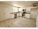 Updated kitchen featuring white cabinets, granite countertops, and stainless steel appliances at 4901 W Cheery Lynn Rd, Phoenix, AZ 85031