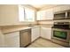 Renovated kitchen, featuring white shaker cabinets, granite counters, stainless steel appliances at 4901 W Cheery Lynn Rd, Phoenix, AZ 85031