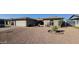 Single story home with attached garage and desert landscaping at 5124 W Onyx Ave, Glendale, AZ 85302