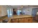 Kitchen with granite island, tile floors, and a fireplace at 5124 W Onyx Ave, Glendale, AZ 85302