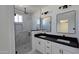 Contemporary bathroom with dual sink vanity and walk in shower at 5403 S 360 Th Ave, Tonopah, AZ 85354