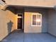 Covered entryway with a dark brown door and window at 5403 S 360 Th Ave, Tonopah, AZ 85354