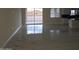 Bright living room with shiny marble floors and sliding glass door at 5403 S 360 Th Ave, Tonopah, AZ 85354