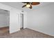 Bright bedroom with ceiling fan and tiled floors at 5406 W Hearn Rd, Glendale, AZ 85306