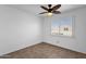 Simple bedroom with ceiling fan and window blinds at 5406 W Hearn Rd, Glendale, AZ 85306