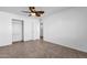 Bedroom with double closets and ceiling fan at 5406 W Hearn Rd, Glendale, AZ 85306