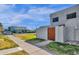 Side view of a townhome showing the front entrance and a street view at 5406 W Hearn Rd, Glendale, AZ 85306