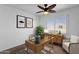 Home office with a wooden desk, comfortable chair, and natural light at 5406 W Hearn Rd, Glendale, AZ 85306