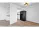 Kitchen area with black refrigerator and white cabinetry at 5406 W Hearn Rd, Glendale, AZ 85306