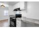 Well-lit kitchen with stove, oven, and overhead range hood at 5406 W Hearn Rd, Glendale, AZ 85306