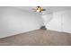 Living room with stairs, tile floor, and ceiling fan at 5406 W Hearn Rd, Glendale, AZ 85306