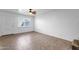 Living room with tile floor, a ceiling fan and a door at 5406 W Hearn Rd, Glendale, AZ 85306