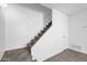 Carpeted staircase with neutral walls and tiled flooring at 5406 W Hearn Rd, Glendale, AZ 85306