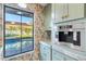 Bright kitchen with updated appliances and a view of the pool at 5720 E Marilyn Rd, Scottsdale, AZ 85254