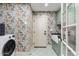 Laundry room with farmhouse sink, green cabinets, and floral wallpaper at 5720 E Marilyn Rd, Scottsdale, AZ 85254