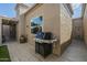 The backyard features a barbecue and tiled patio, perfect for outdoor cooking and entertaining at 6366 N 19Th St, Phoenix, AZ 85016