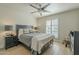 Cozy bedroom with wood floors, a ceiling fan, and a Queen size bed is move-in ready at 6366 N 19Th St, Phoenix, AZ 85016