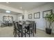 Bright dining room features modern table, six chairs, skylight and adjacent bar with seating at 6366 N 19Th St, Phoenix, AZ 85016