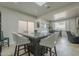 Kitchen island seats four and is enhanced by skylight and adjacent dining and living areas at 6366 N 19Th St, Phoenix, AZ 85016